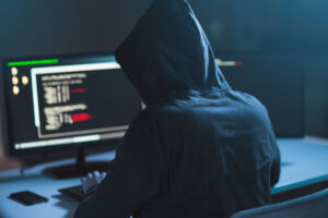 Cybercrime,,Hacking,And,Technology,Concept, ,Male,Hacker,In,Dark